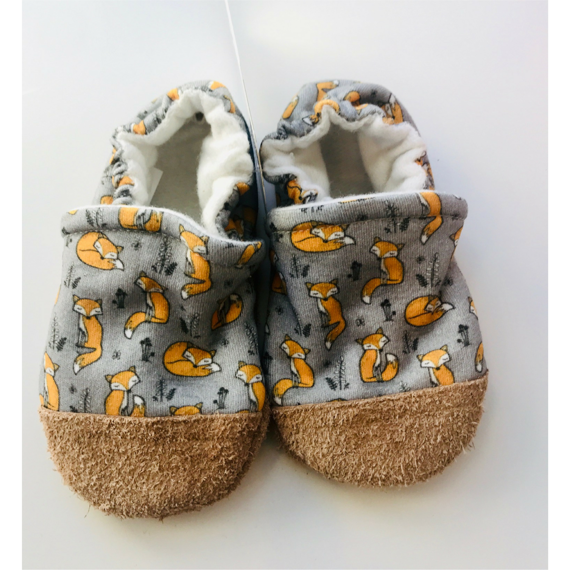Organic cotton gray fabric with orange sleeping fox. Infant slipper with soft leather sole